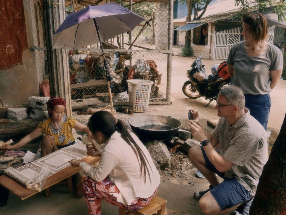 Ha Giang Loop itinerary for seniors: A Comfortable 4-Day Car Itinerary 12 Tourists experiencing traditional handicraft village on Ha Giang Loop itinerary for seniors