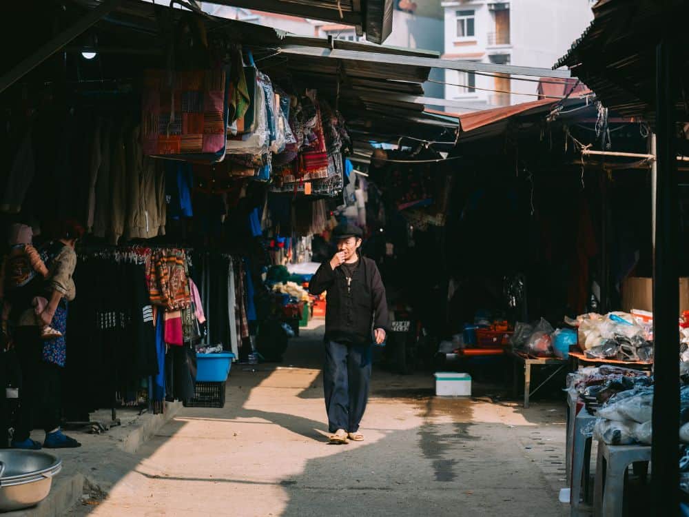 A busy alleyway inside the highland market