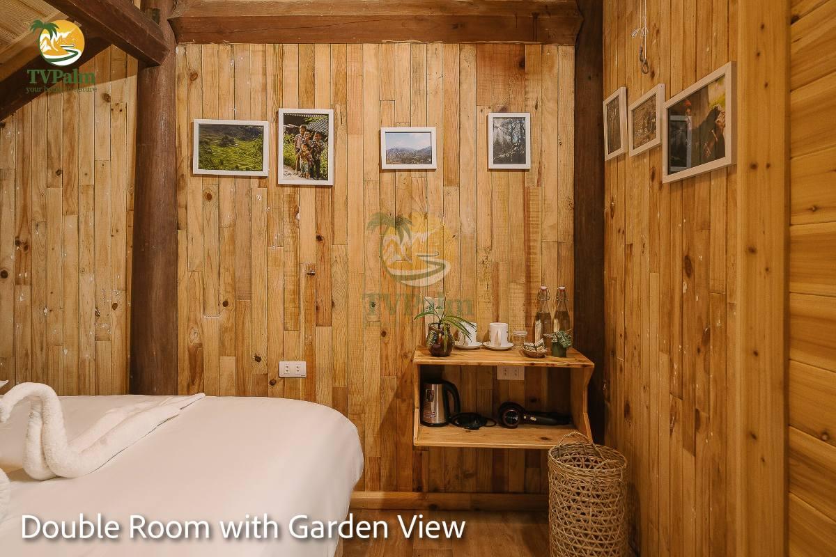 Double Room with Garden View at TVPalm Ha Giang with rustic wood cabin design and garden atmosphere