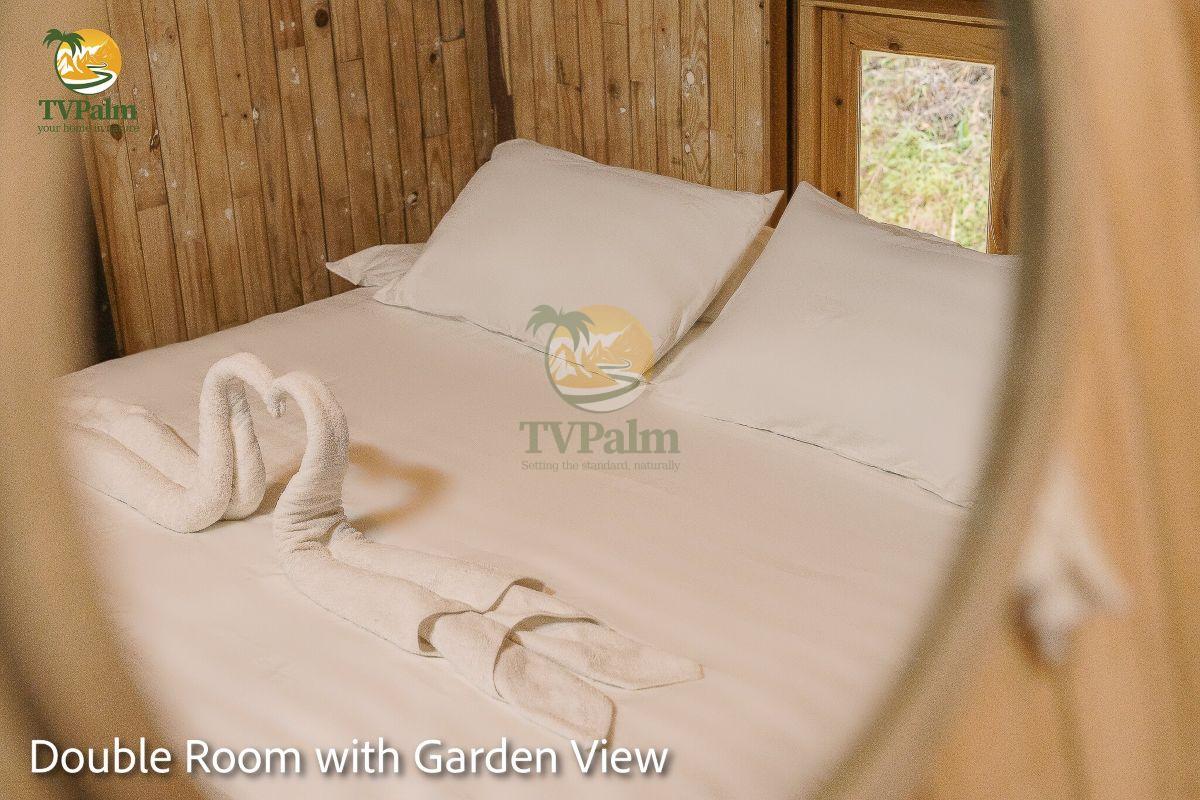 Double bed setup inside Double Room with Garden View at TVPalm Ecolodge Ha Giang
