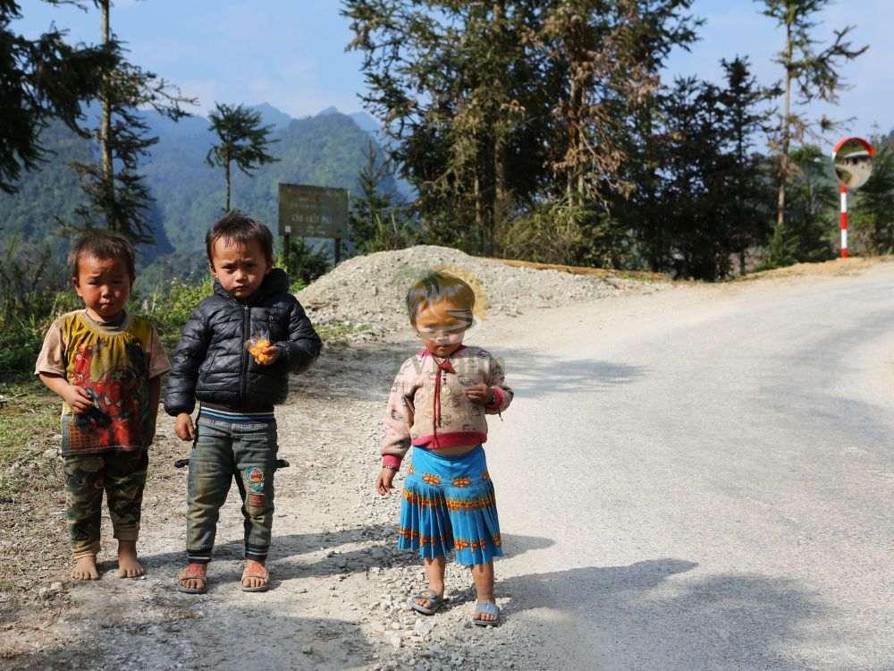 Friendly local children meeting travelers on Ha Giang loop 2 days