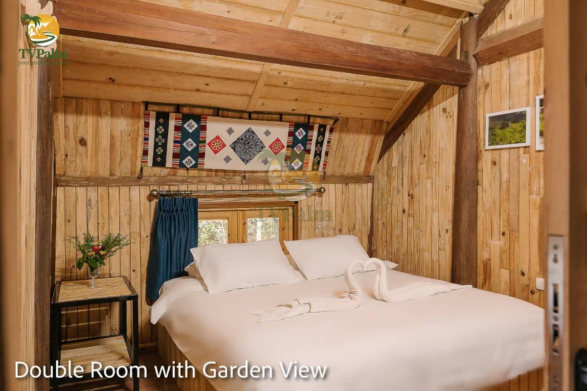 Garden View Double Room at TVPalm Ha Giang with natural wood architecture and relaxing ambiance