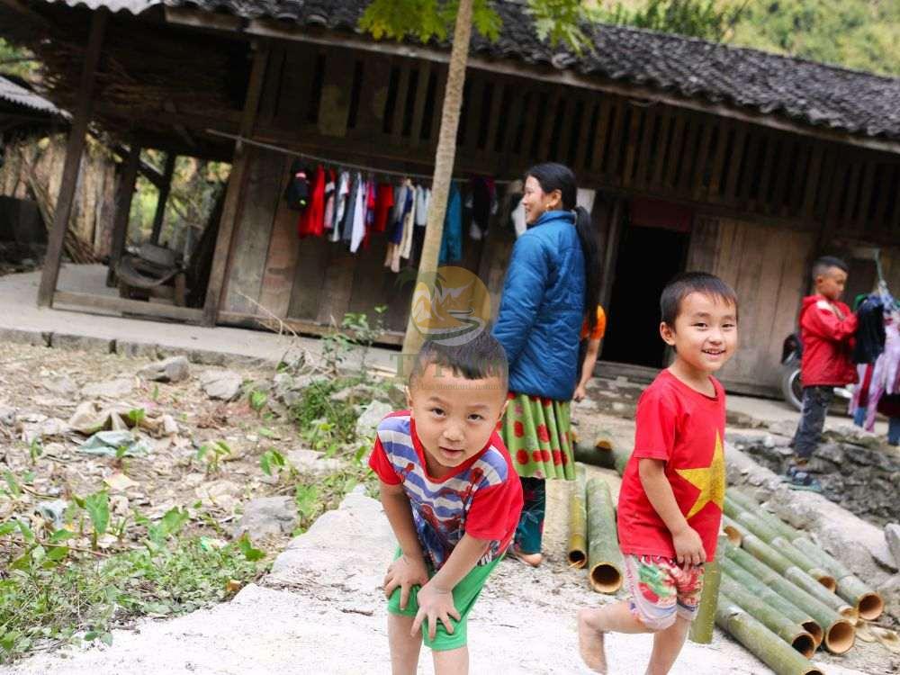 Happy local children in a village on Ha Giang loop 2 days