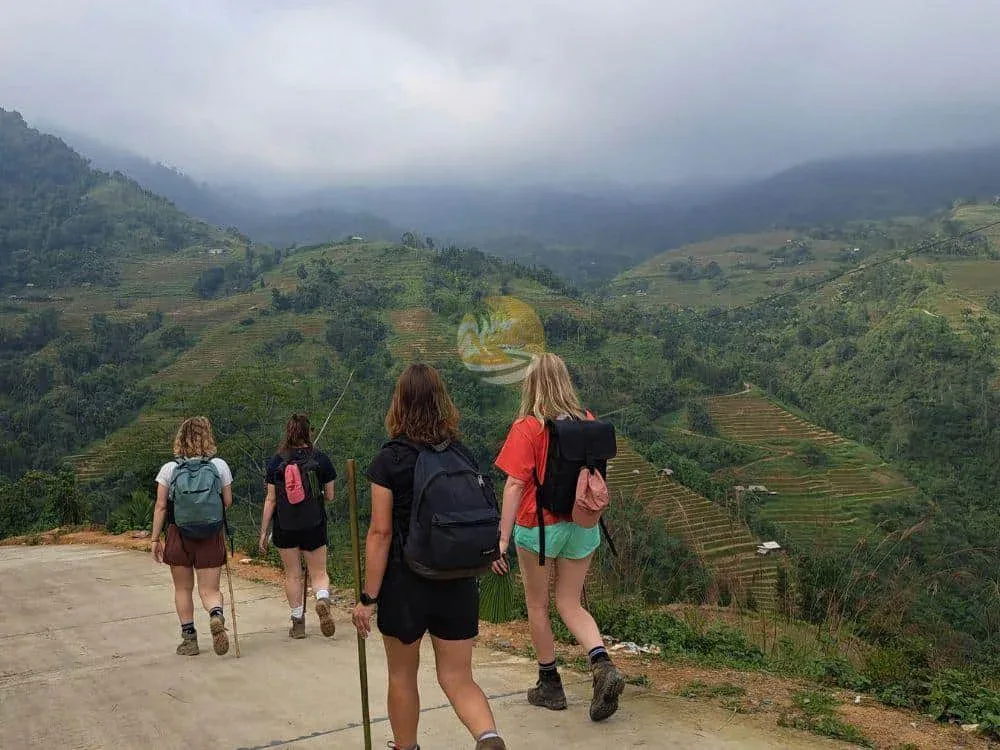 Hikers walking on a mountain trail during a 2-day in Tay Con Linh
