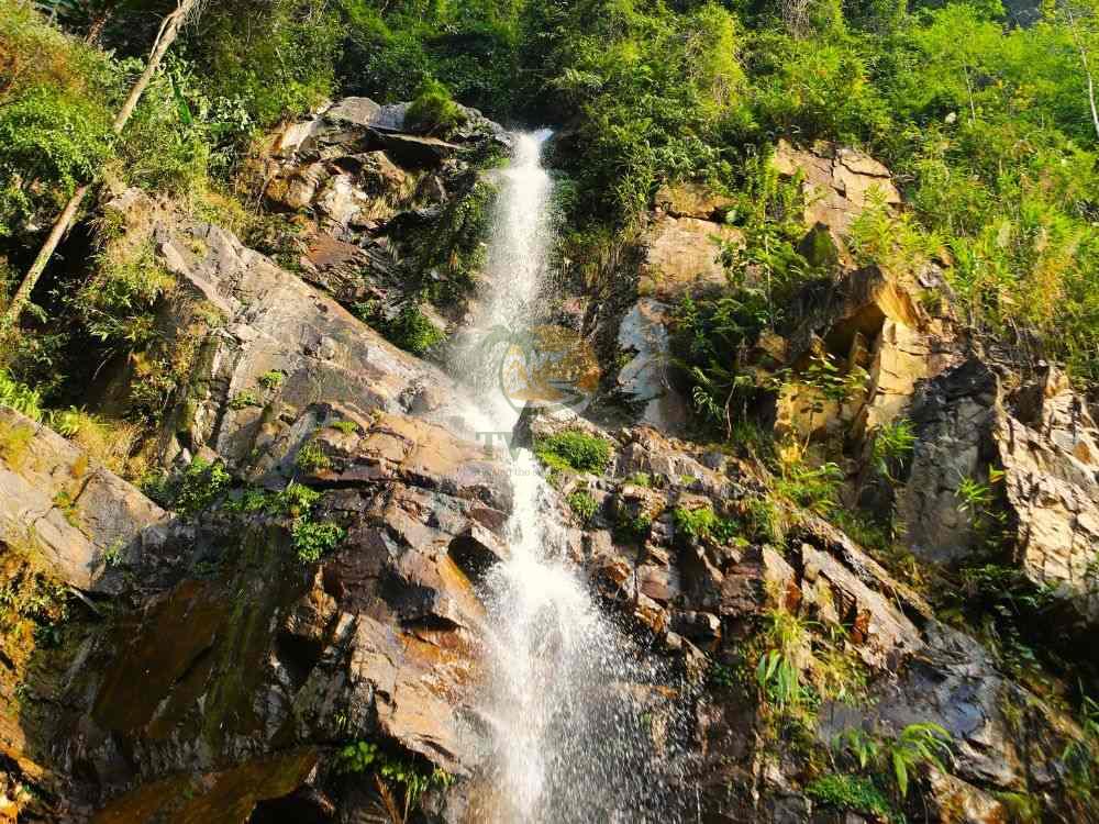 Majestic waterfall scenery on a Ha Giang Loop tour 4 days
