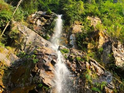 Majestic waterfall scenery on a Ha Giang Loop tour 4 days