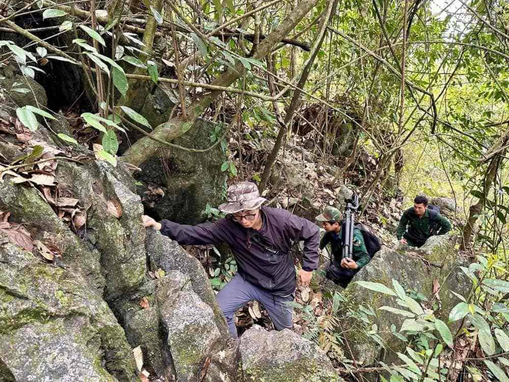 Rangers climbing steep terrain