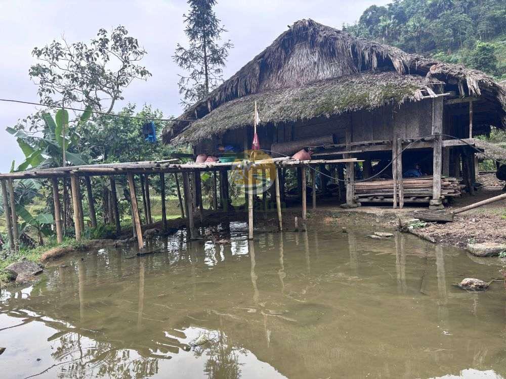 Stilt house reflecting in a pond, 2 Days 1 Night Khuoi My - Xa Phin landscape