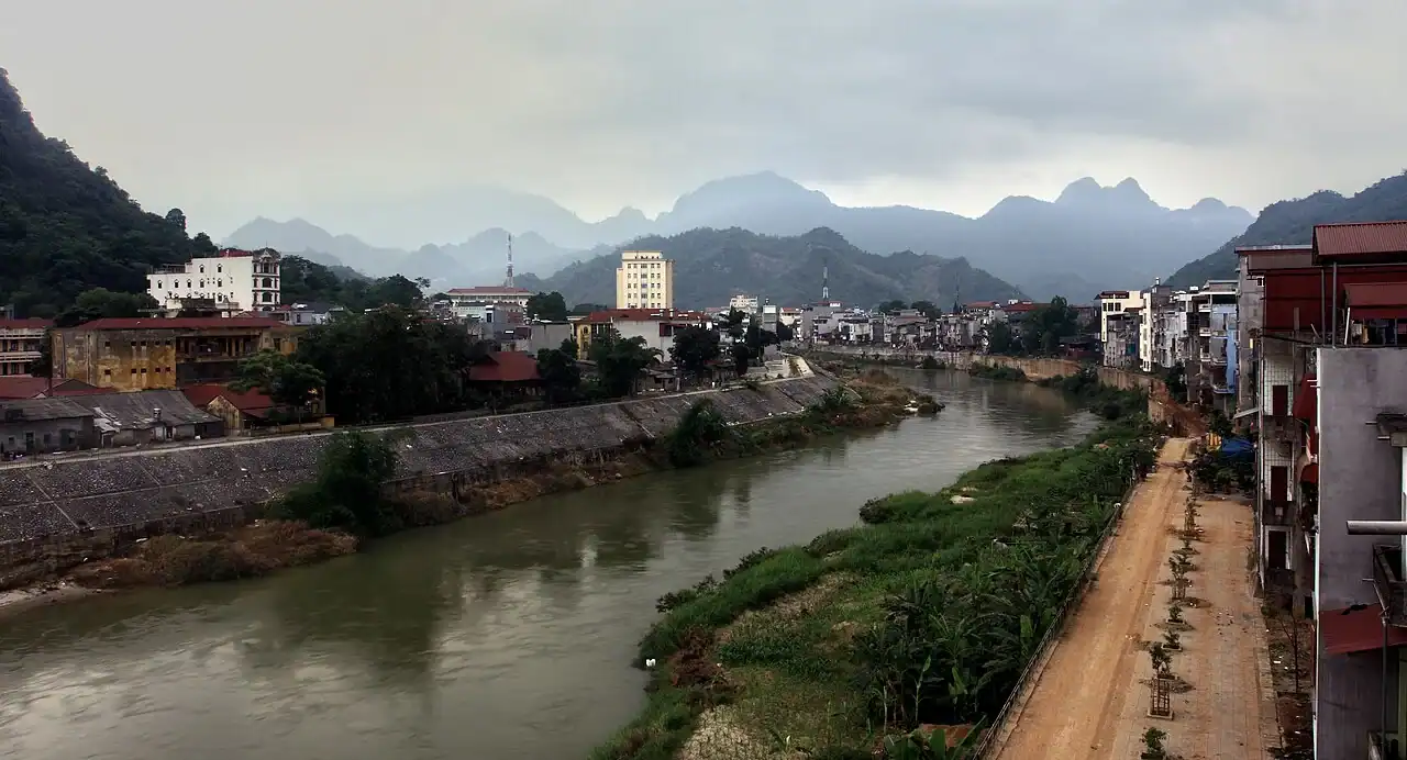 Panoramic view of Ha Giang City nestled in the valley surrounded by karst mountains and Lo River