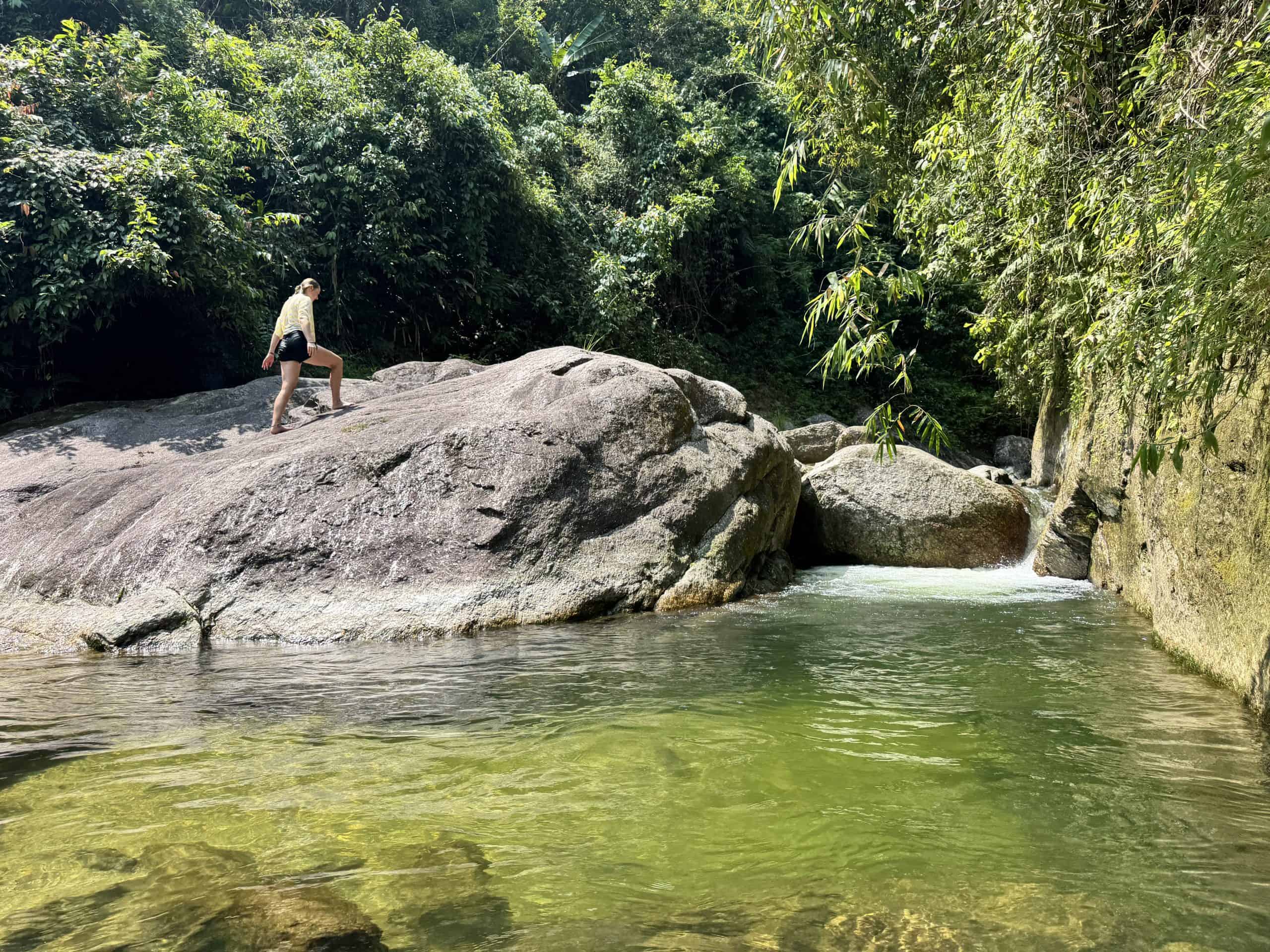 The cold pool at Lung Vai, fed by a mountain stream, on the day-2 walking route below Tay Con Linh, Ha Giang