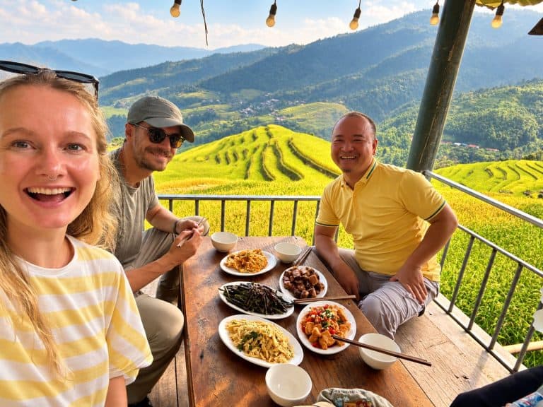 Lunch with guests on a terrace overlooking golden rice terraces
