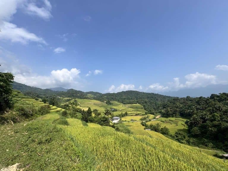 Rice terraces and Dao houses in the valley at Na Thac, seen from the viewpoint above the welcome gate on the eastern slope of Tay Con Linh, Ha Giang