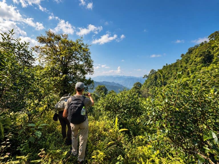 Trekkers taking photos of the mountain view from the Tay Con Linh trail