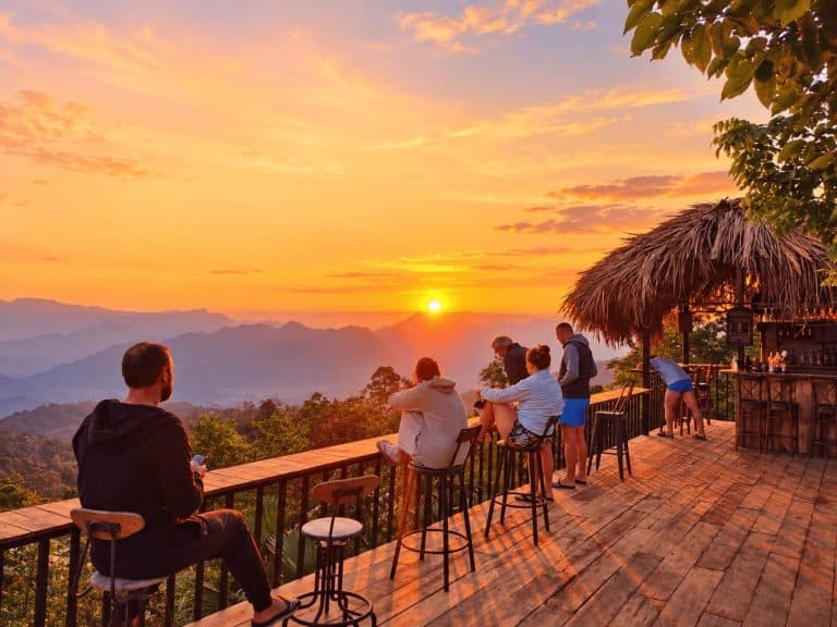Guests watching the sunset from The Palm Clouds Bar