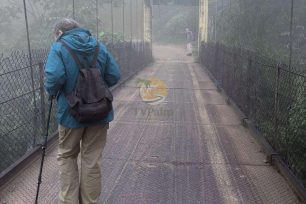 Backpacker walking on a quiet road away from Dao Ao Dai Villages