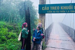 Group of trekkers at the entrance gate of Dao Ao Dai Villages