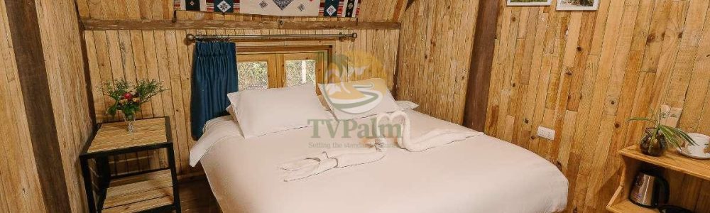 Spacious Double Room with Garden View in Ha Giang featuring comfortable double bed and wooden décor