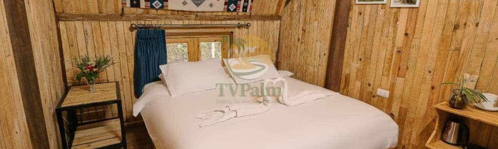 Spacious Double Room with Garden View in Ha Giang featuring comfortable double bed and wooden décor